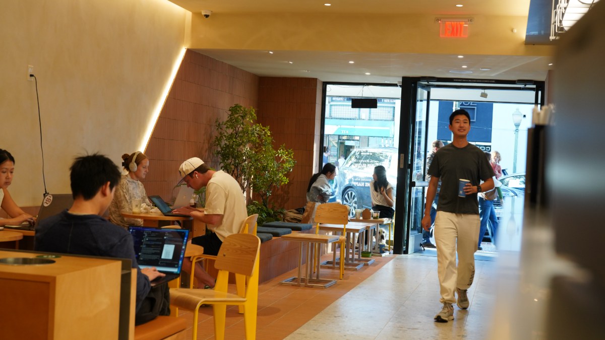 Customers working with laptops in the Palo Alto cafe